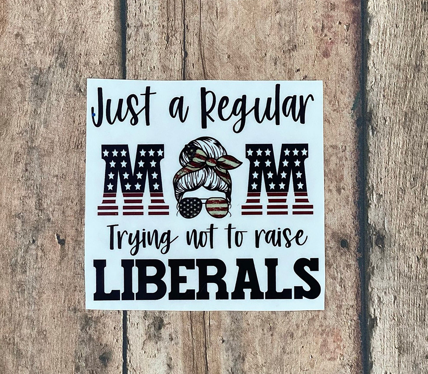 Just a Regular Mom Trying Not to Raise Liberals - Vinyl Sticker - Decal - Windows, Laptops etc.